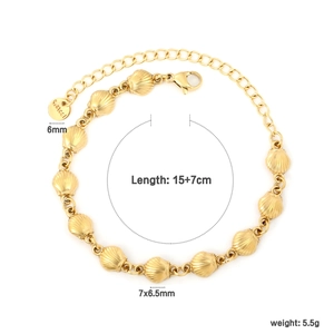Detail showing 18K gold shell bracelet links with size labels and S.Steel hallmark