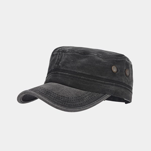 Detail of charcoal washed cotton cadet cap featuring vintage texture and copper side buckles