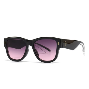 Cat eye sunglasses with black frame and purple-pink gradient lenses at a 45-degree angle