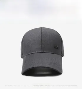 Detailed front view of dark gray baseball cap with stiff twill fabric and metal side logo