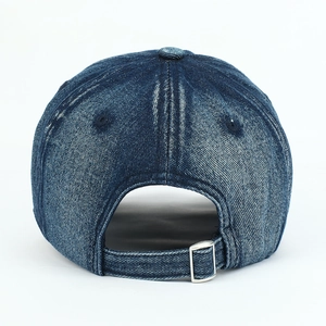 Close-up of vintage blue washed denim baseball cap with silver metal adjustable buckle strap
