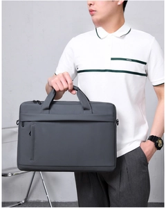 Detail of dark grey business laptop bag with vertical zipper pocket and matte texture