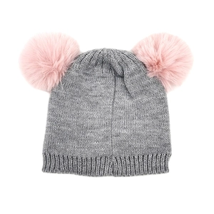 Kids winter knit beanie with grey ribbed fabric and two pink faux fur pom poms