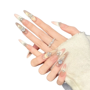 Pink and gold gradient stiletto press-on nails with luxury rhinestones and pearls