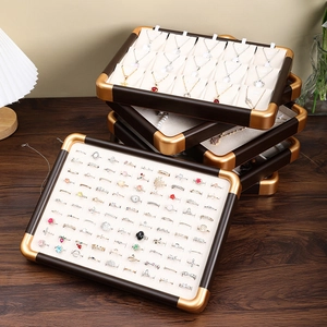 Walnut wood jewelry display trays with gold corners and microfiber lining for rings