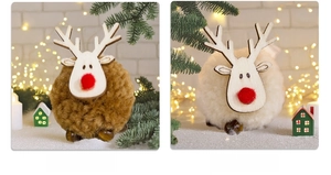 Detail of plush reindeer ornaments with wooden faces and red noses for Christmas decor