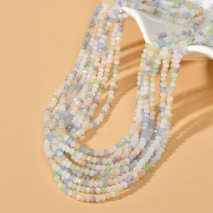 Macro detail of mixed pastel 3mm faceted glass beads for DIY necklaces and jewelry