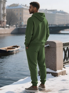 Detail of men's olive green hooded tracksuit featuring textured geometric knit fabric
