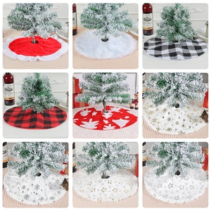 Various Christmas tree skirts in plush, plaid, and snowflake styles for festive home decor