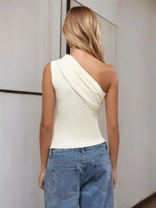 Detail of off-white one-shoulder slim T-shirt featuring elegant fabric texture and draping