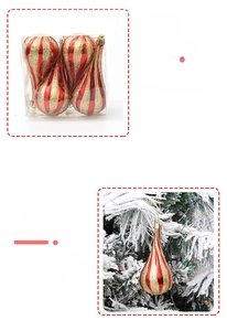 Detail of red and gold striped waterdrop Christmas ornaments hanging on a snowy tree