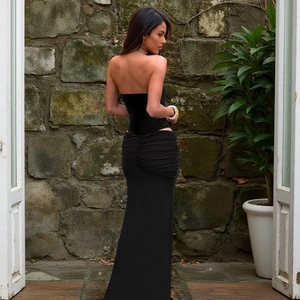 Elegant black strapless maxi dress with slimming ruching and ruffles for summer style