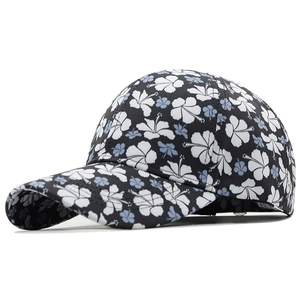Black baseball cap with blue hibiscus floral print and curved brim for sun protection