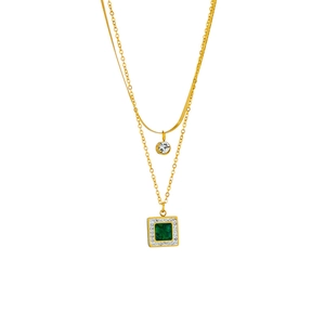 Double-layered gold chain necklace with square emerald pendant and clear crystal accents