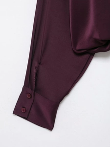 Detailed macro view of dark purple poplin shirt cuffs with satin texture and buttons
