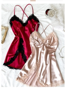 Detailed macro view of silk satin nightgown featuring elegant lace trim and V-neckline