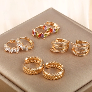 Detailed set of four gold-plated hoop earrings featuring zircon stones and braided textures