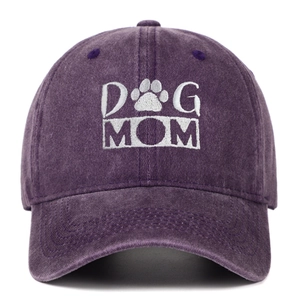 Close-up of DOG MOM white embroidery and paw print on vintage washed purple cotton baseball cap