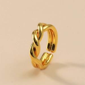 Detail view of gold twisted braid open ring with polished high-shine finish
