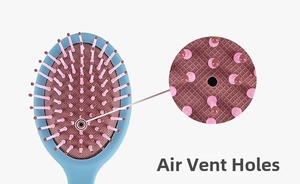 Detail showing the air cushion vent and pink round-tip bristles on a blue hairbrush