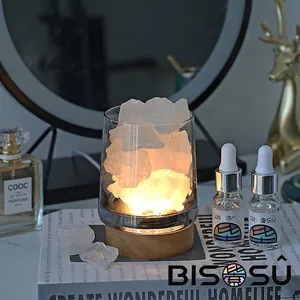 Natural crystal stone aroma diffuser set with warm light wooden base and essential oils