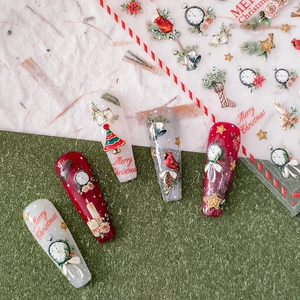 3D Christmas nail art stickers with red reindeer, golden stars and festive tree designs