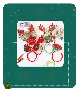 Detail view of festive reindeer antlers and Christmas hat headbands made of plush fabric