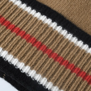 Close-up of wool knit beanie with classic British striped pattern and ribbed texture