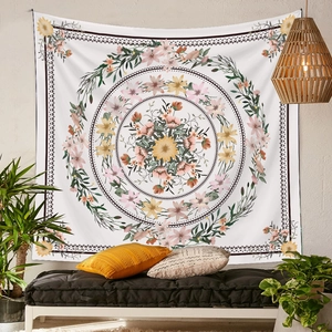 Detailed close-up of a bohemian floral mandala tapestry hanging on a cozy living room wall