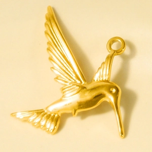 Detailed close-up of a polished gold stainless steel hummingbird pendant for DIY jewelry