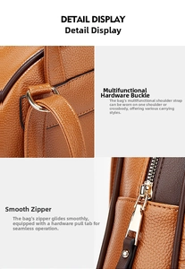 Detail of brown lychee leather bag with gold hardware and smooth metal zipper