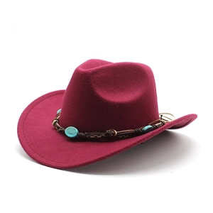 Detail of burgundy wool cowboy hat featuring turquoise beads and metal chain on leather band