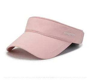Detail view of pink sports sun visor with white lettering and breathable quick-dry fabric