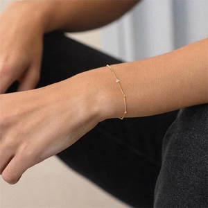 Detail of gold-plated S925 sterling silver bead bracelet with sparkling round zircon