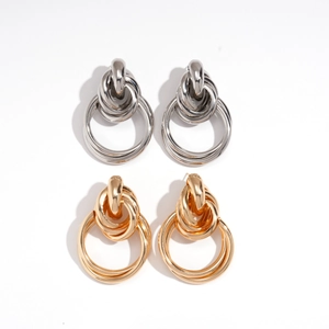 Minimalist interlocking geometric metal knot hoop earrings in polished gold and silver finish
