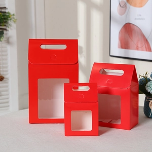 Three-piece red kraft gift bags with window display and sturdy carry handles