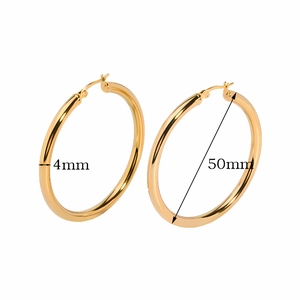 Detail view of 50mm gold hollow hoop earrings with 4mm tube width on white background
