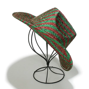 Detail of red and green striped sequin cowboy hat with metallic glitter finish