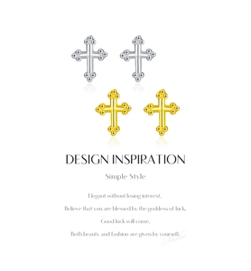 Detail view of s925 sterling silver cross earrings in gold and silver finishes