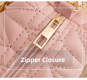 Macro detail of pink quilted handbag showing zipper closure and gold-tone hardware