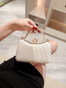 Elegant cream pleated satin evening clutch with pearl handle and rhinestone clasp
