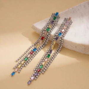 Detailed view of luxury silver tassel earrings with colorful square zircon and crystals