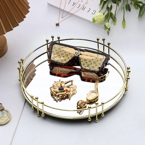 Plateau miroir rond doré moderne avec cadre en métal pour bijoux et décoration d'intérieur