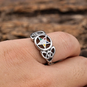 Detail of silver Eastern Star ring with colorful enamel inlay on a model's hand
