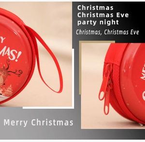 Close-up of smooth double zipper and elk print on a red Christmas tin coin purse