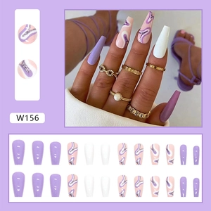 Macro detail of coffin-shaped press-on nails with purple marble and silver glitter