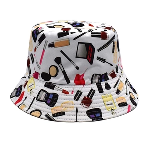 Detail of white cotton bucket hat featuring colorful cosmetic themed print patterns