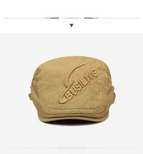Détail d'un béret kaki matelassé avec surpiqûres en losanges et broderies de précision