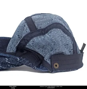 Detail of soft cotton lining and adjustable buckle on washed denim newsboy cap