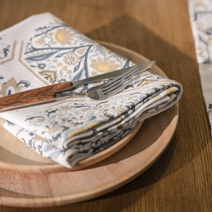 Vintage floral linen napkin set on a wooden tray with cutlery for home dining decor